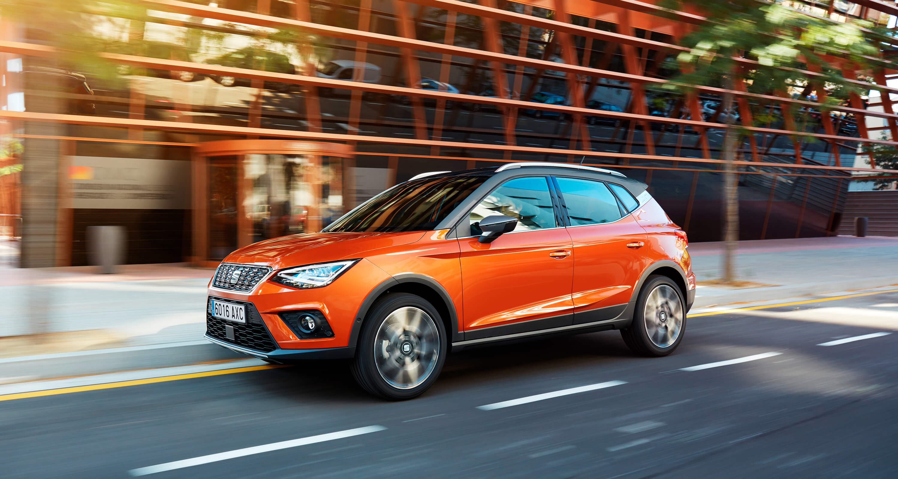 orange eclipse SEAT Arona exterior design outdoor side city shot