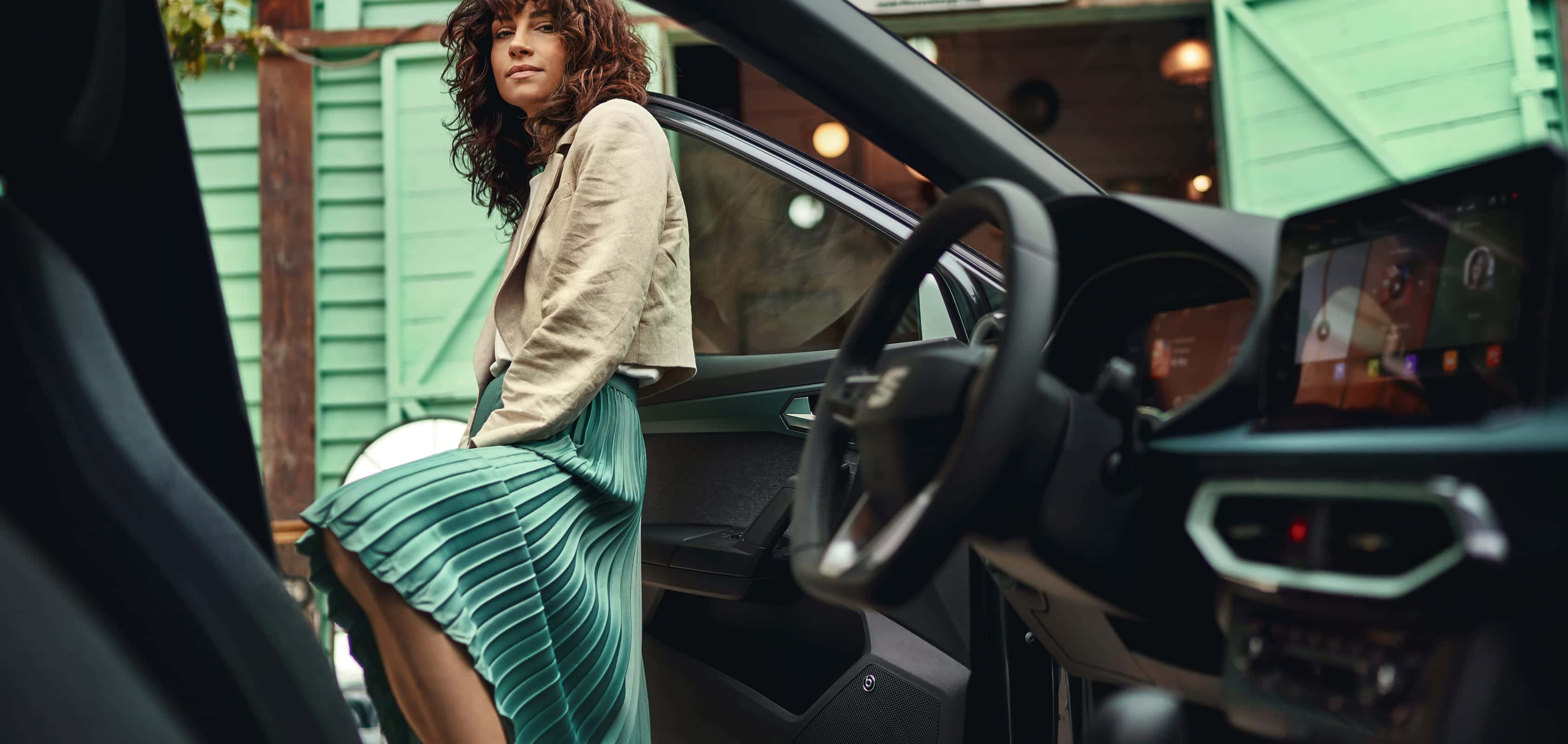 SEAT Arona interior view of a woman entering the vehicle