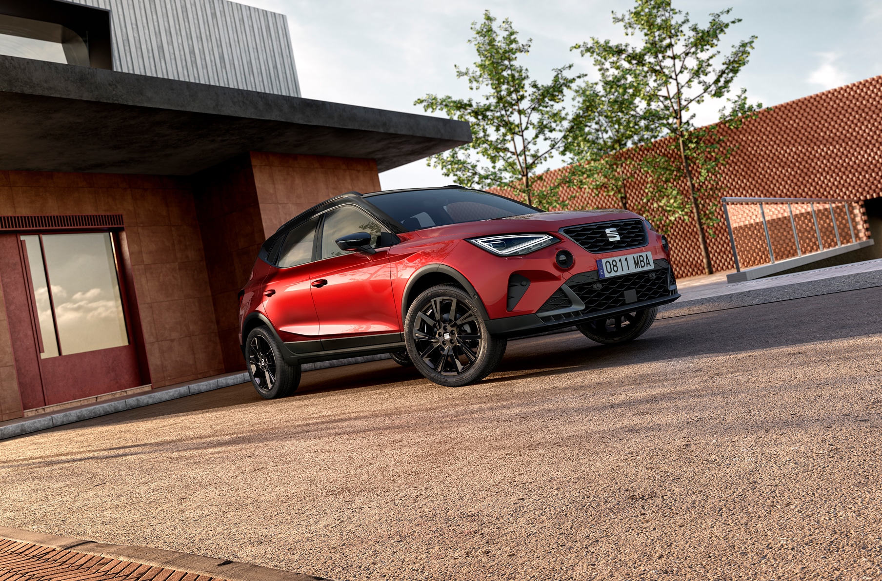 new seat arona black edition in desire red, showcasing 18 inch black cosmo wheels, black side skirts, black roof rails and grey air vents.