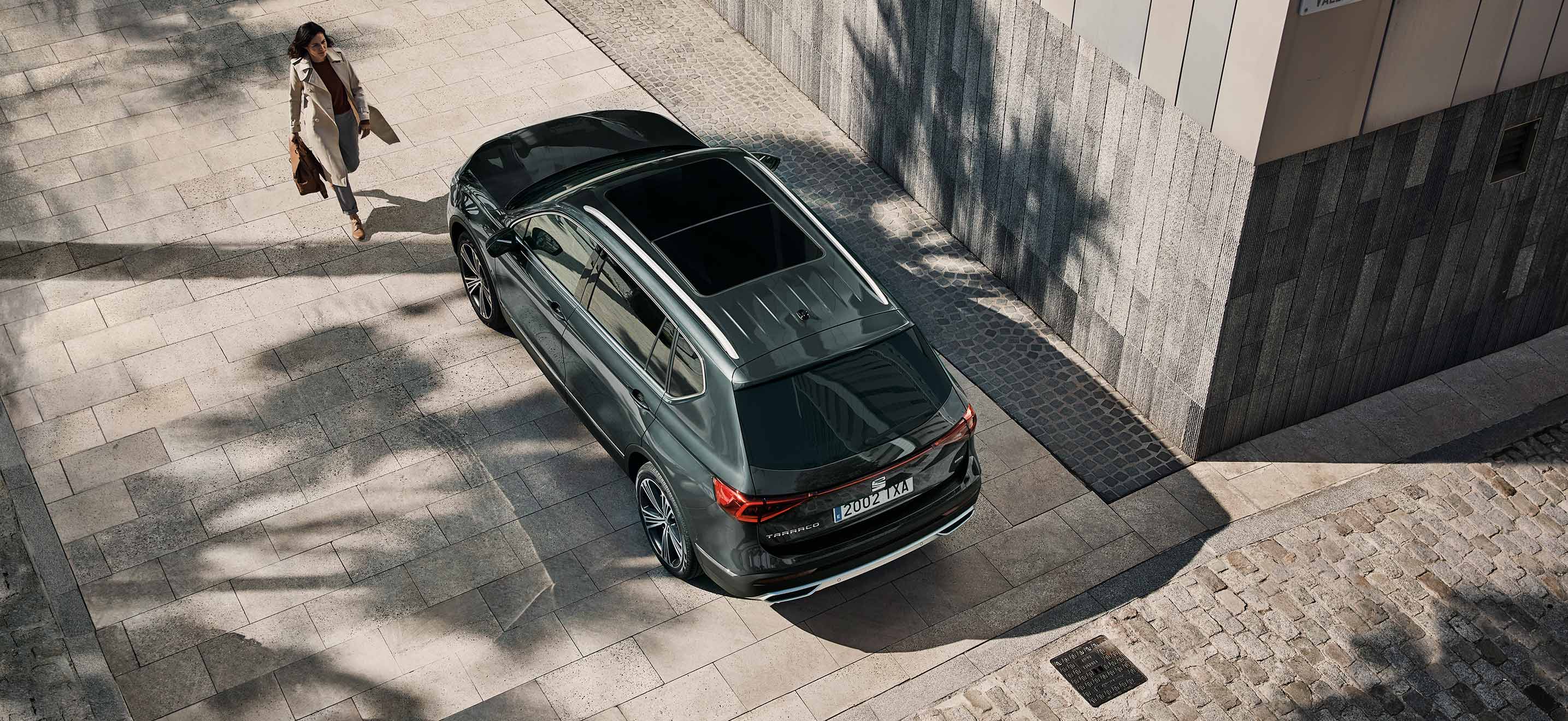 New SEAT Tarraco SUV 7 seater top view of car and woman walking
