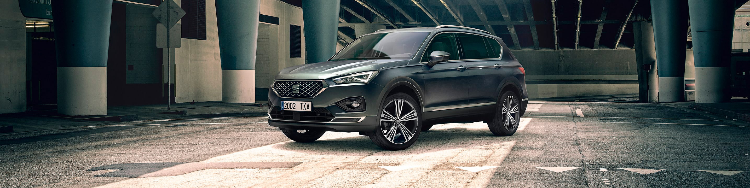 New SEAT Tarraco SUV 7 seater parked outside building beauty shot