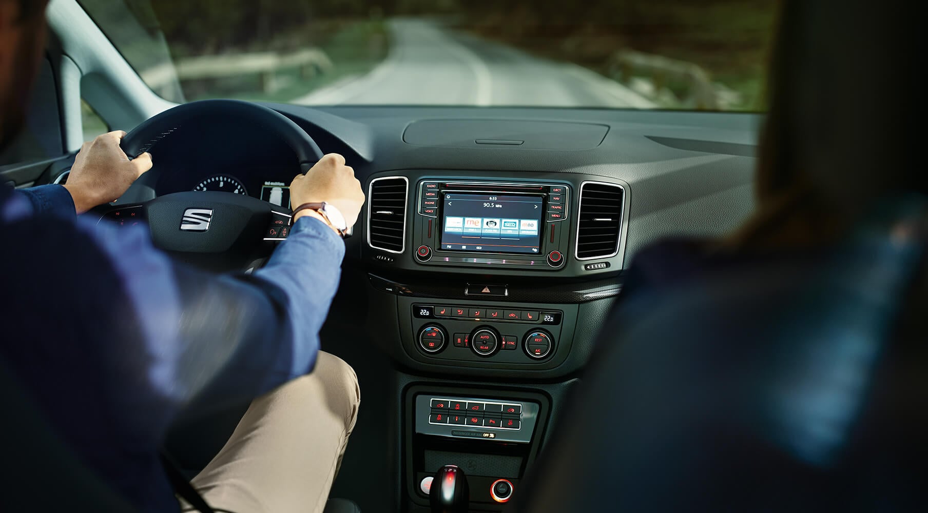 SEAT new car services and maintenance – Side view interior of a man driving a SEAT new car